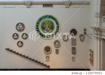 Interior view of Ceramic round Medieval and Renaissance era artworks galleries on wall 110079401