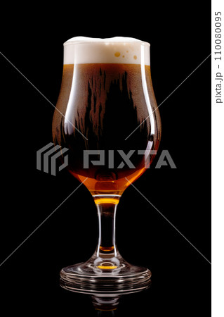 Beer in a tall glass on a dark black background. Mugs with drink like Ipa, Pale Ale, Pilsner, Porter or Stout Beer in a tall glass on a dark black background. Mugs with drink like Ipa, Pale Ale, Pilsner, Porter or Stout 110080095