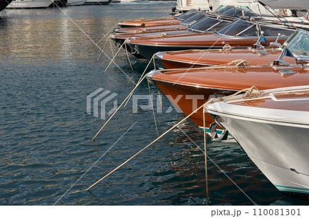 Few luxury retro motor boats in row at the famous motorboat exhibition in the principality of Monaco, Monte Carlo, the most expensive boats for the richest people, boats for rich clients Few luxury retro motor boats in row at the famous motorboat exhibition in the principality of Monaco, Monte Carlo, the most expensive boats for the richest people, boats for rich clients 110081301
