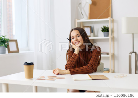 table education teenager desk exam girl schoolgirl student preparation notebook 110086186