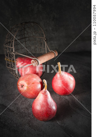 fresh red pear on dark background fresh red pear on dark background 110087994