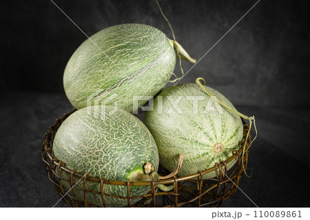 Fresh honeydew melon on dark background 110089861