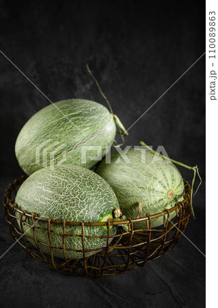 Fresh honeydew melon on dark background 110089863