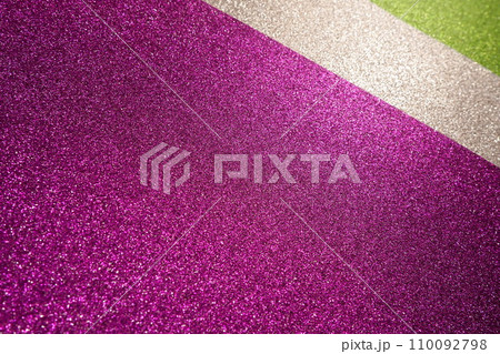Light on a purple lilac pink violet white green surface. Bokeh glow. Festive shining background. New Year, Christmas, birthday. Plastic card design. Velvety rough paper, pink cardboard, slightly bent Light on a purple lilac pink violet white green surface. Bokeh glow. Festive shining background. New Year, Christmas, birthday. Plastic card design. Velvety rough paper, pink cardboard, slightly bent 110092798