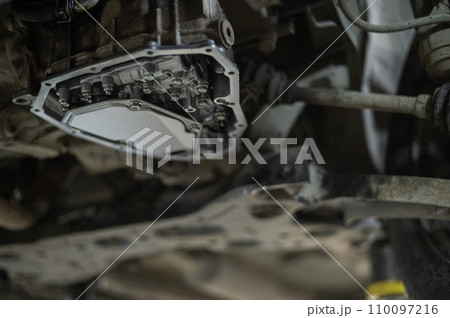 Replacing the gearbox oil prefilter. Car on a lift in a car service center.  110097216