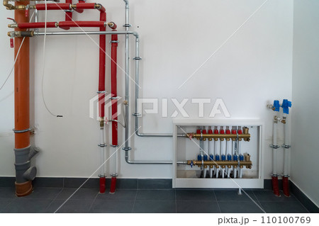 Distributor of central heating. Pipes on Central Heating Distributor Distributor of central heating. Pipes on Central Heating Distributor 110100769
