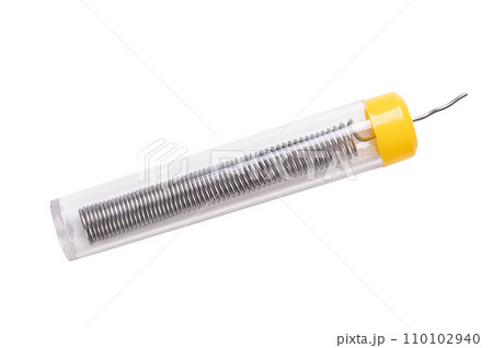 Soft solder wire for electrical use, coiled up, in a plastic tube. Fusible metal alloy of 60 percent tin and 40 percent lead, used to create a permanent bond between metal workpieces. Isolated. Photo. Soft solder wire for electrical use, coiled up, in a plastic tube. Fusible metal alloy of 60 percent tin and 40 percent lead, used to create a permanent bond between metal workpieces. Isolated. Photo. 110102940