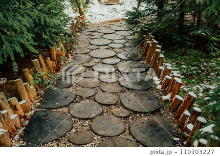 Creative idea for garden paths made of wood, log cabin. Winter nature. 110103227