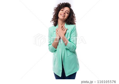 young pretty curly brunette employee of a business company woman stylishly dressed in a jacket on a young pretty curly brunette employee of a business company woman stylishly dressed in a jacket on a 110105576