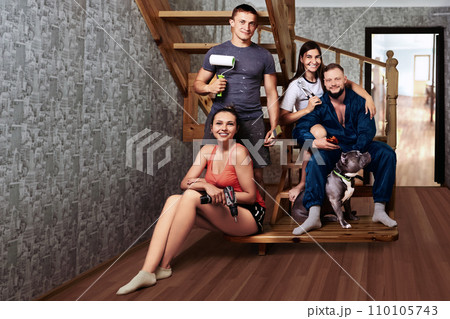 Young people with construction tools in their hands are preparing for home repairs. 110105743