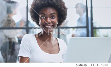 business woman with her staff in background at office business woman with her staff in background at office 110106096