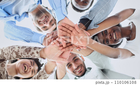 Closeup portrait, bottom view, happy faces of different team employees standing in circle 110106108