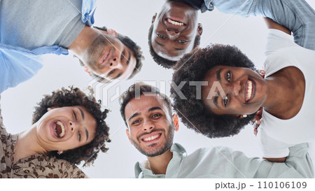 Closeup portrait, bottom view, happy faces of different team employees standing in circle 110106109