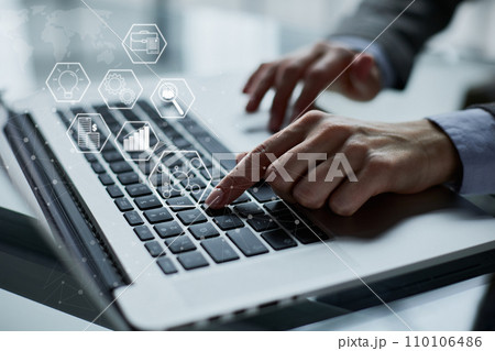 Close-up of male hands using laptop at office 110106486