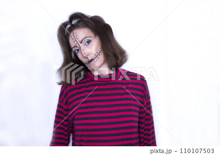 Halloween makeup doll with stitches on the face Halloween makeup doll with stitches on the face 110107503