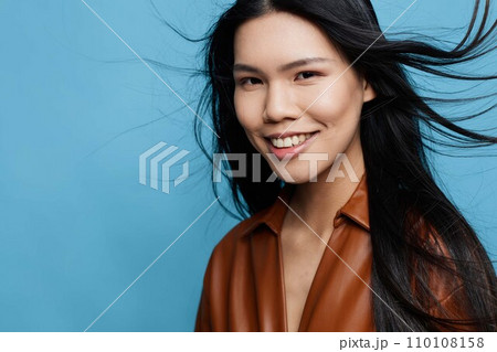 Studio woman blue background trendy girl smile happy asian Studio woman blue background trendy girl smile happy asian 110108158