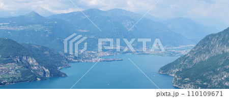Mountain landscape, picturesque mountain lake in the summer morning, large panorama. Iseo, Italy Mountain landscape, picturesque mountain lake in the summer morning, large panorama. Iseo, Italy 110109671