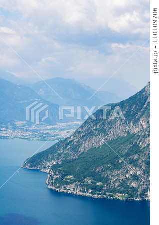 Mountain landscape, picturesque mountain lake in the summer morning, large panorama. Iseo, Italy 110109706
