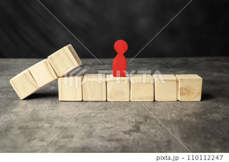 A wooden figure and a row of wooden cubes A wooden figure and a row of wooden cubes 110112247