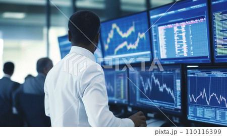Portrait of a financial analyst in front of monitors with charts and indicators tracking market reactions to changes, big date analysis Portrait of a financial analyst in front of monitors with charts and indicators tracking market reactions to changes, big date analysis 110116399