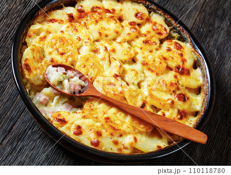 au gratin potatoes with diced ham and green peas au gratin potatoes with diced ham and green peas 110118780