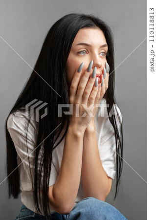 Portrait of a young girl who looks sad. 110118813