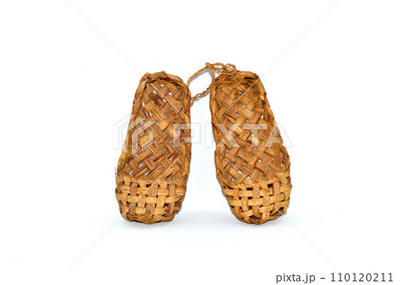 Russian traditional ancient bast shoes made of bast isolated on white background 110120211