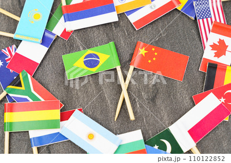 The concept is diplomacy. In the middle among the various flags are two flags - China, Brazil 110122852