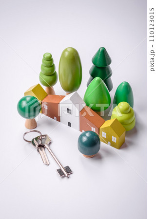 A small wooden house and keys as an idea for investing in your own home 110123015