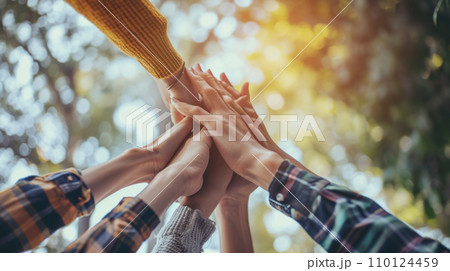 AI-generated content. A Group of People Putting Their Hands Together 110124459