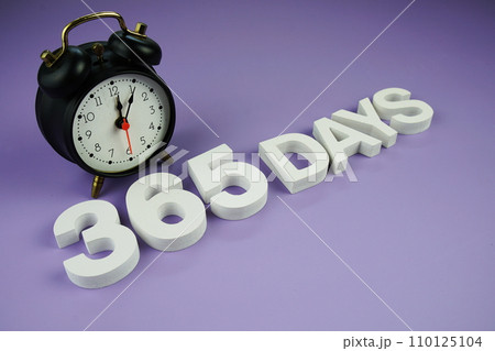 365 Days alphabet letters with alarm clock top view on purple background, business and education concept background 365 Days alphabet letters with alarm clock top view on purple background, business and education concept background 110125104