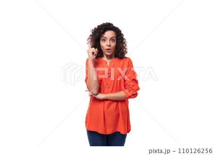 young smart caucasian business woman with curly hairstyle dressed in orange shirt feels inspired 110126256