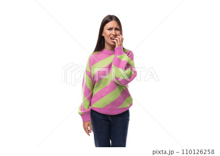 portrait of a young brunette woman in a striped pink green blouse on a white background with copy portrait of a young brunette woman in a striped pink green blouse on a white background with copy 110126258