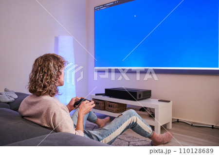Gamer boy in his room 110128689