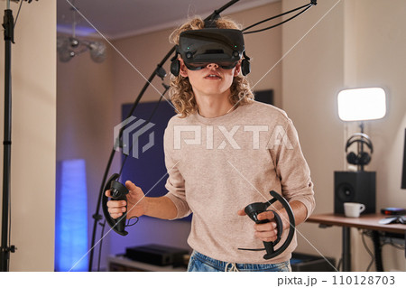 Young active guy in his room Young active guy in his room 110128703