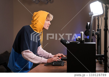 Young active guy in his room Young active guy in his room 110128789