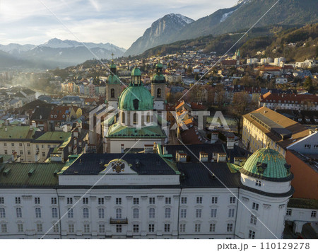 Innsbruck at evening, Aerial Drone Shot of a Beautiful winter City Skyline, Surrounded by Alps Mountains in Austria 110129278