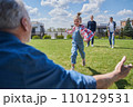 Little kid girl running to her senior grandfather while meeting him 110129531