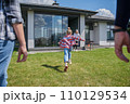 Back view of the little kid girl running to her senior grandfather 110129534