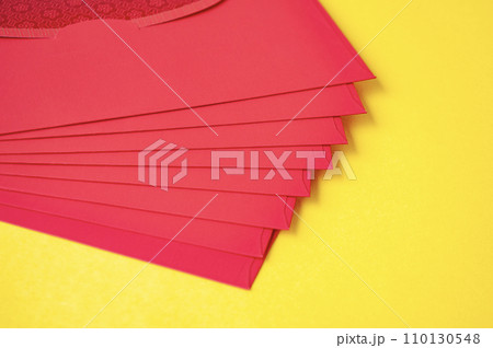 Red envelopes on yellow cover background with customizable space for text Red envelopes on yellow cover background with customizable space for text 110130548