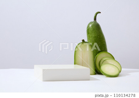 Concept scene stage showcase for new product with winter melon and a podium arranged. Winter melon (Benincasa hispida) has cosmetic uses for the face and hair 110134278