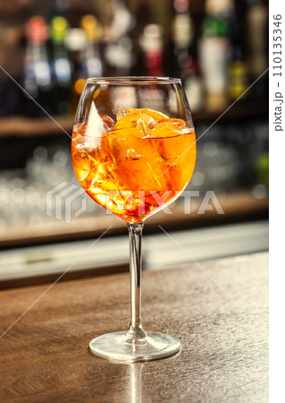 Aperol Spritz cocktail drink on the bar counter ready for the guest Aperol Spritz cocktail drink on the bar counter ready for the guest 110135346