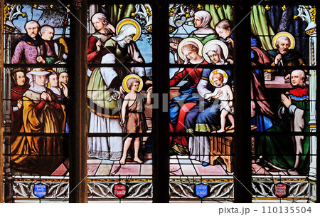 St. John the Baptist introduced by his mother, St. Elizabeth, the Infant Jesus and the Holy Kinship, stained glass window in Saint Severin church in Paris St. John the Baptist introduced by his mother, St. Elizabeth, the Infant Jesus and the Holy Kinship, stained glass window in Saint Severin church in Paris 110135504