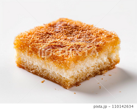Close-up of Arabic dessert Kunafa on a white background. Close-up of Arabic dessert Kunafa on a white background. 110142634