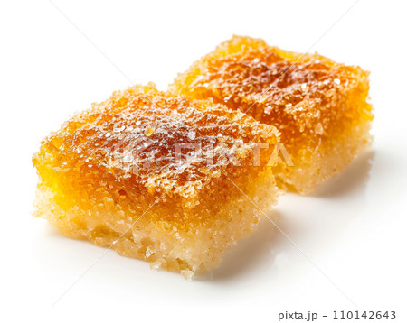 Close-up of Arabic dessert Kunafa on a white background. Close-up of Arabic dessert Kunafa on a white background. 110142643