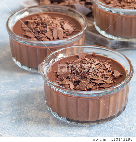 Chocolate dessert Panna Cotta in glass ramekin, square 110143196