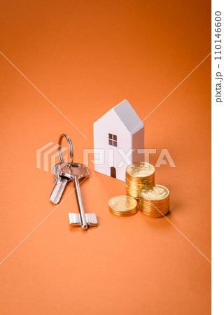 A small wooden house and keys as an idea for investing in your own home 110146600