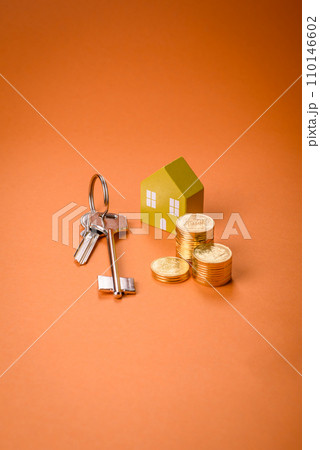A small wooden house and keys as an idea for investing in your own home 110146602