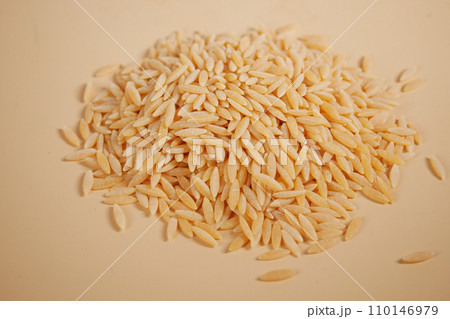 top view of brown long rice on table . top view of brown long rice on table . 110146979