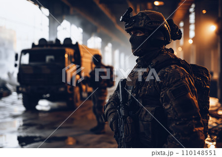 Two soldier of police special forces stand in a hangar for protect the area. 110148551
